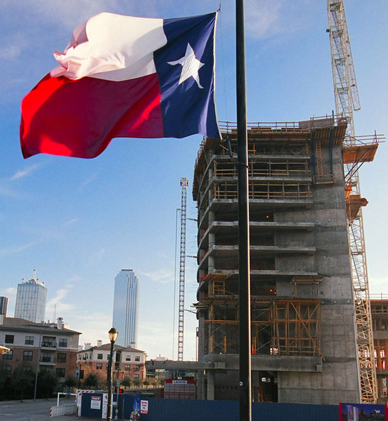 Dallas, TX: Texas Flag Waves in Front of W Hotel construction