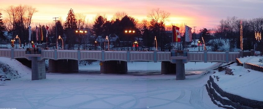 Frankenmuth, MI: Snowfest sunset, Cass river bridge to River Platz