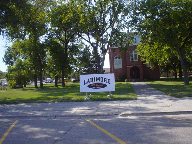 Larimore, ND: The city Muesuem and a sign displaying the cities age.