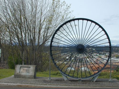 Shelton, WA: The "Big Wheel" at the east entrance to town, from a lumber mill, celebrating the lumber history of the town.