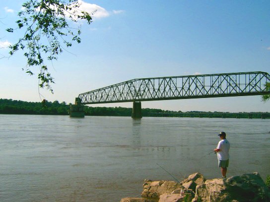 Granite City, IL: Man Fishing Under Chain of Rocks Bridge