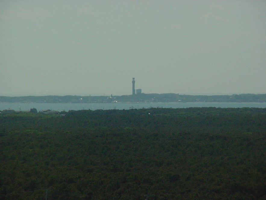 Truro, MA: View of Provincetown Memorial from the Cape Cod Lighthouse (Highland Lighthouse)