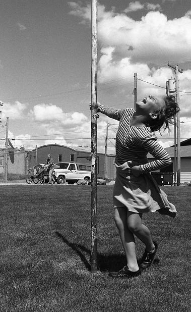 Harlem, MT: A local girl mugs for the camera in 1999. Taken during my cross country bike trip. Our group spent the night in Harlem and everyone was extremely friendly. I don't know this girl's name but I thought her family might like a copy of this shot.