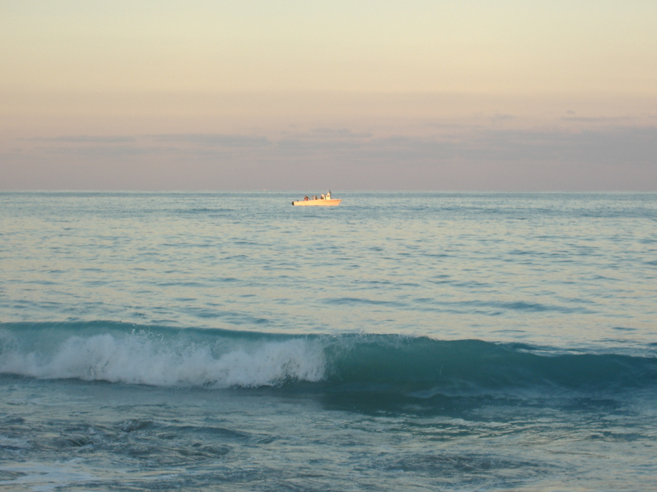 Juno Beach, FL: fishing boat at sunset off of juno beach
