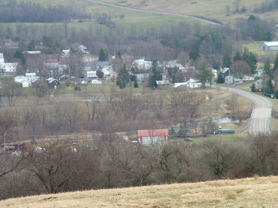Cincinnatus, NY: Picture of the town over looking from a hill