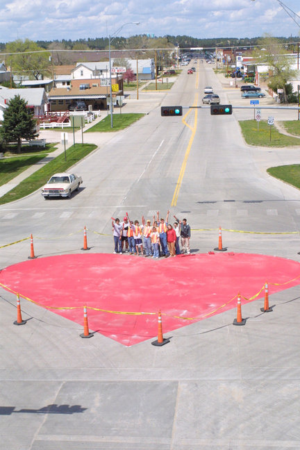 Valentine, NE: photo by Laura Vroman with Midland News by permission; Painting the Heart of the Heart City at the intersection of 20 and Main Street, looking north.