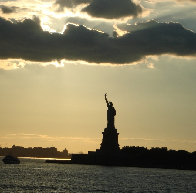 New York, NY: The famous statue near sunset from Staten Island Ferry