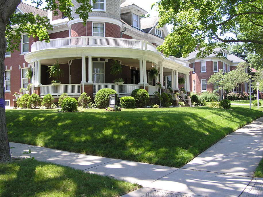Highland, IL: Meridith Funeral Home on a typical, tree-lined residential street.