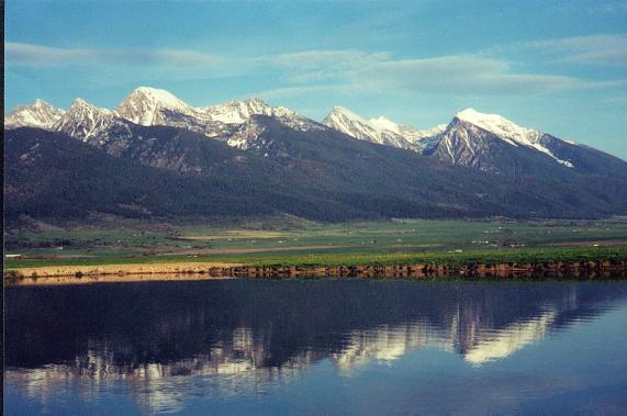 Charlo, MT: Mission Mtn Range reflecting in Charlo, MT pond of Olsen Family.