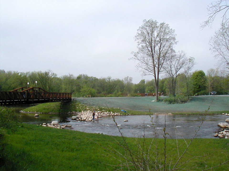 Mount Pleasant, MI: Millpond Park in center of Mt. Pleasant, with walking paths and river fishing access.