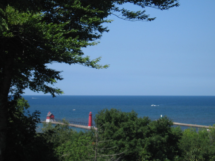 Grand Haven, MI: View of the famous Grand Haven lighthouse and pier from my Uncle's backyard.