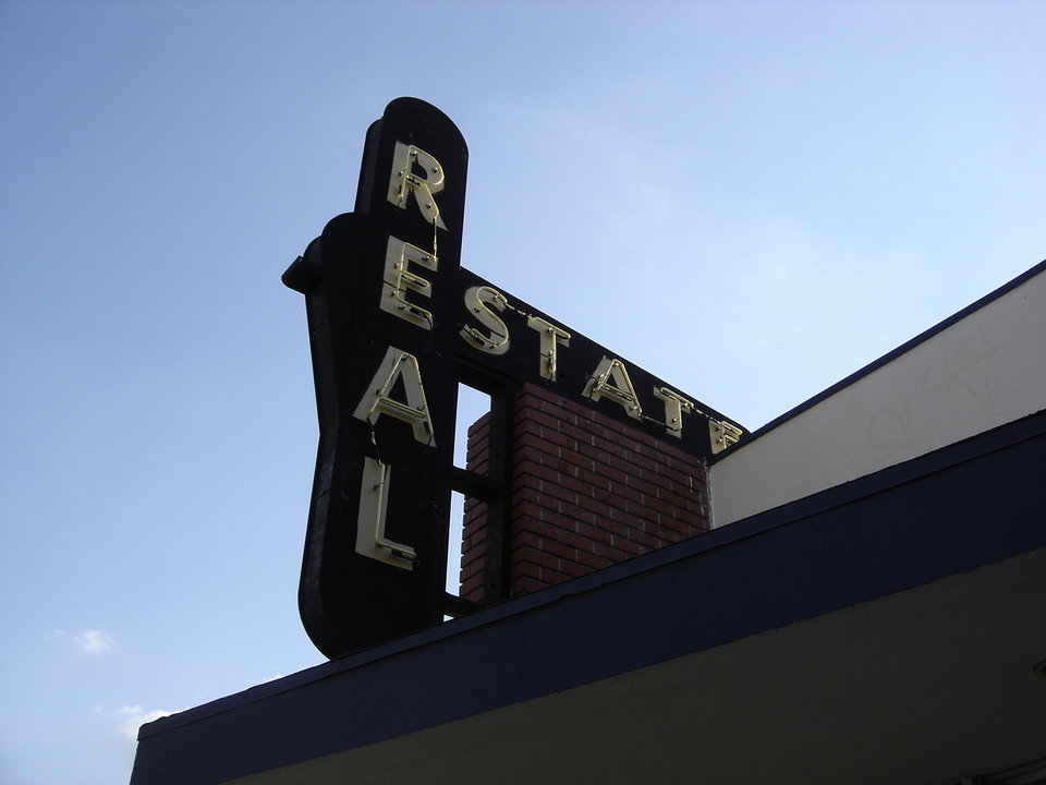 Whittier, CA Old fashioned real estate sign on the front of our real