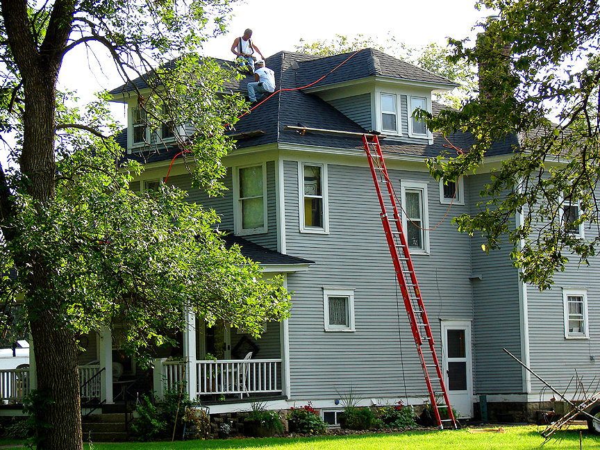 Pomeroy, IA On one of the hottest days of the year, two roofers toil