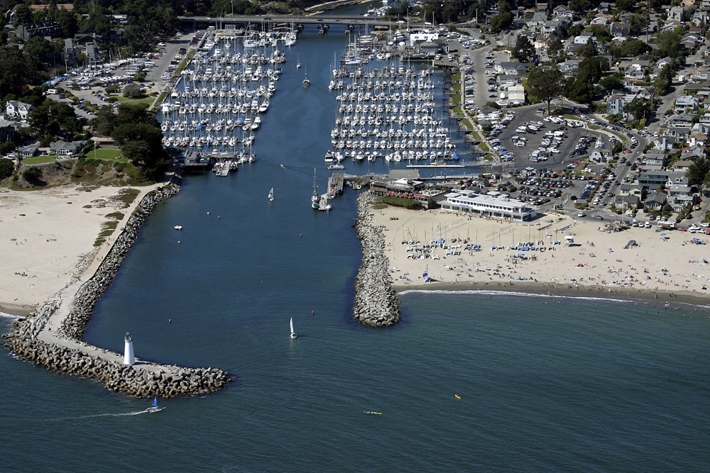 Santa Cruz, CA: An aerial view of Twin Lakes State Beach and the Walton Lighthouse. Located at the northern end of the Monterey Bay, the Santa Cruz Harbor is a haven for fishing craft and vessels.
