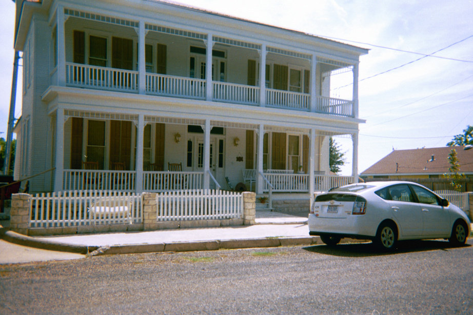 Fayetteville, TX: Antique vs. High Tech... This home built in 1890 sports a high tech hybrid car. Chances are the house will long out last the car. The car, however, is more fuel efficient. Both are located in beautiful, quaint downtown Fayetteville, Texas.