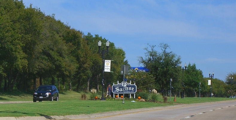 Sachse, TX: Town sign entering Sachse on Sunny October afternoon