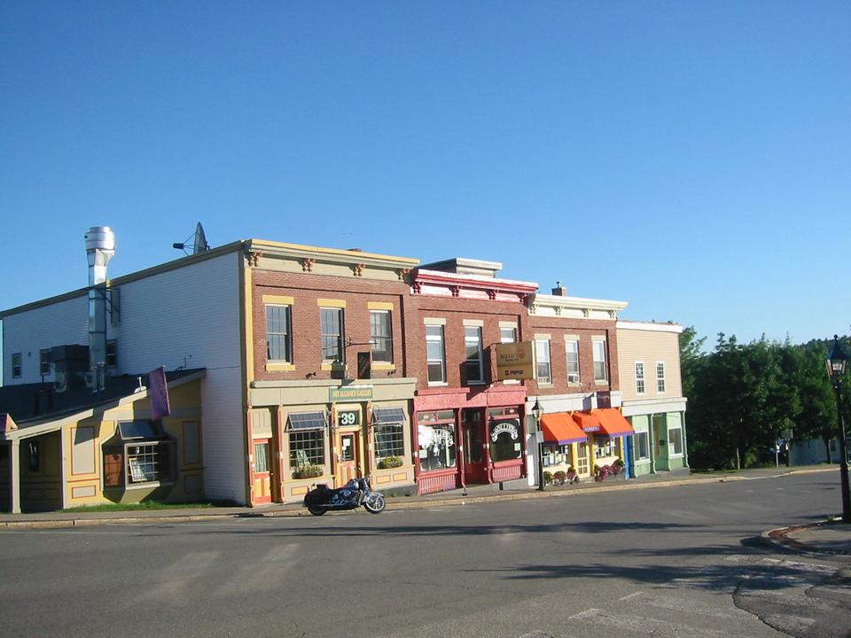 Belfast, ME: Harley Davidson Parked in front of Rollies Bar