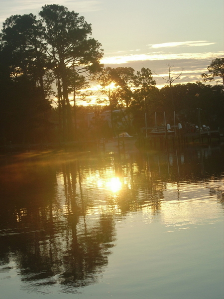 Northwest Escambia, FL: sun coming up over bayou grande - sky reflecting on water