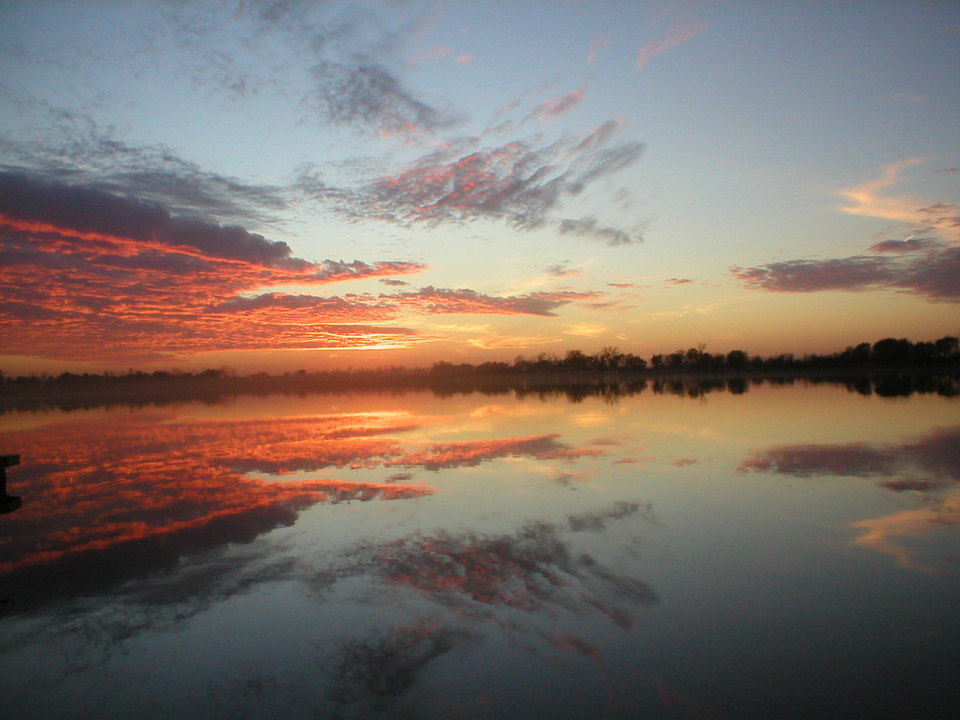 Big Lake, MO: Sunset during harvest time