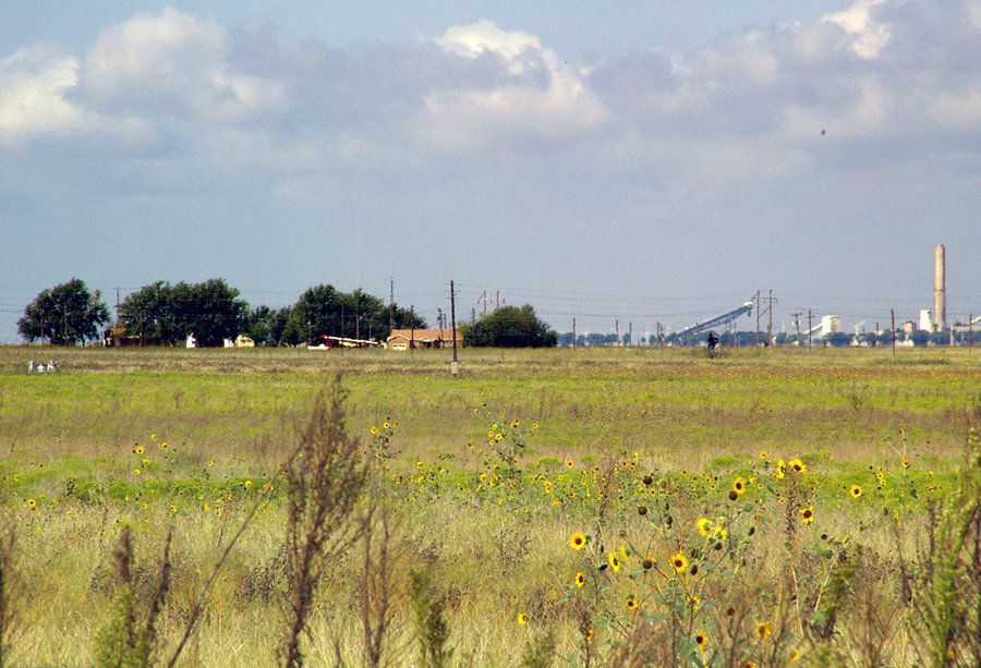 Pampa, TX: FARMSTEADS AND SMOKESTACKS southwest of Pampa represent the staples of its economy, agriculture and light industry.