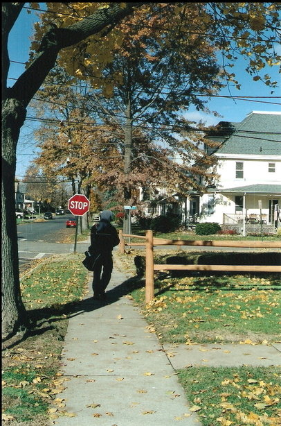 Westwood, NJ: Mailman walking through a local neighborhood