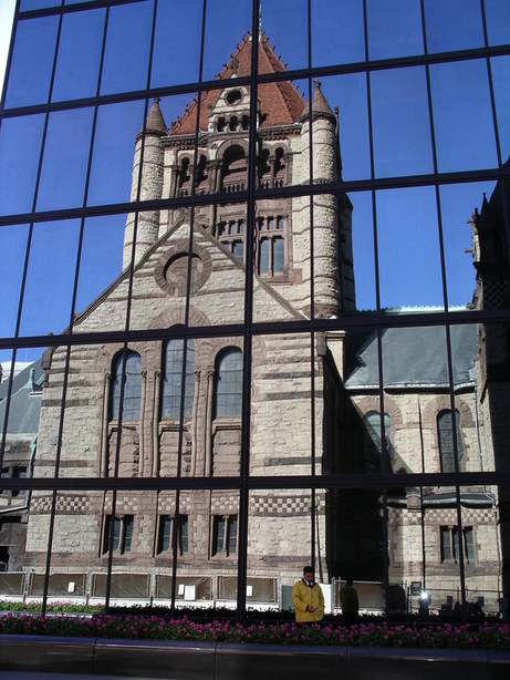 Boston, MA: The Holy Trinity Church reflected in an office building