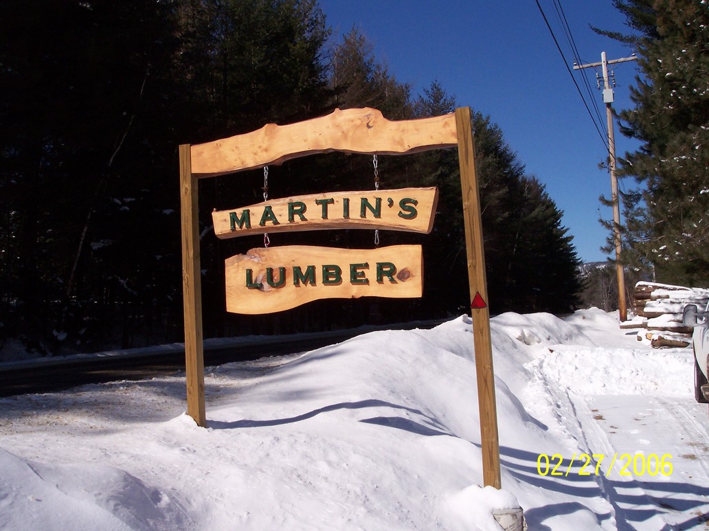Thurman, NY: Martins Lumber with bright blue winter sky in back