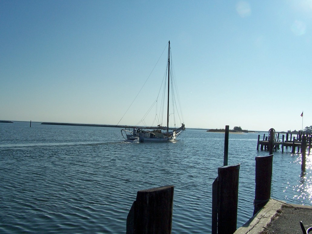Deal Island, MD: The skipjack City of Crisfield leaving the harbor in Wenona, one of the Deal Island harbors.