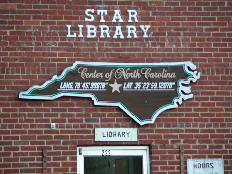 Star, NC: Old town hall, now library. With sign showing Star as the geographical center of NC