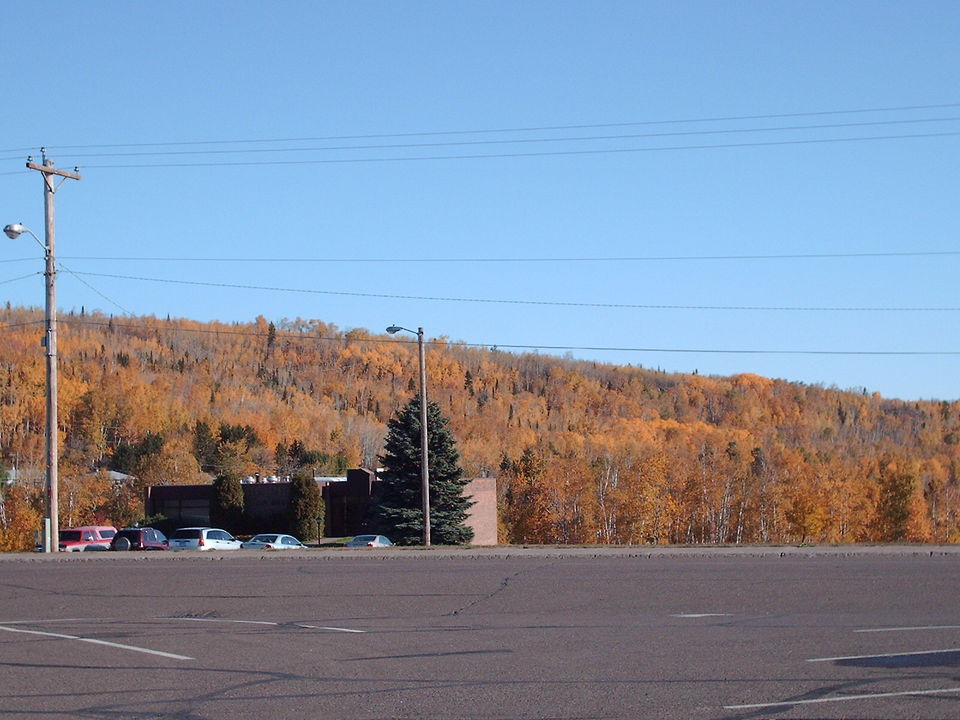 Silver Bay, MN: View of the town's hill side from the main parking lot of the town's shopping center in Silver Bay, MN.