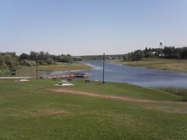 Baudette, MN: Picture of the Rainy River that forms part of the U.S. - Canada border separating northern Minnesota and northwestern Ontario. The bridge seen in the background in an entrance to Canada.