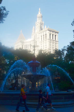 New York, NY: Fountain in City Hall Park at dusk, City Hall in background