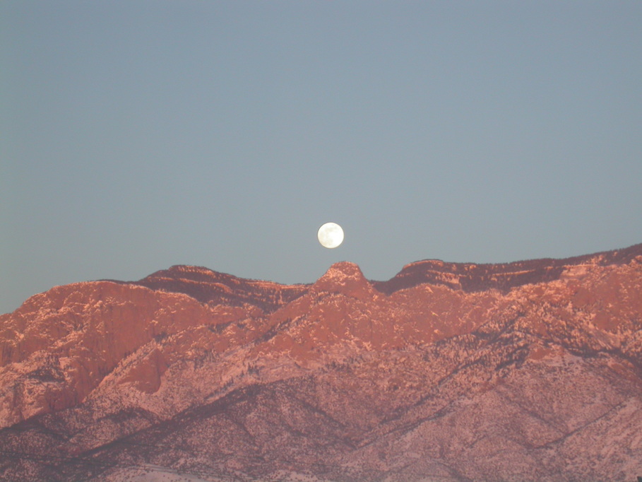 Albuquerque, NM: Moonrise and Sunset Over Sandia Mountain in Albuquerque, NM