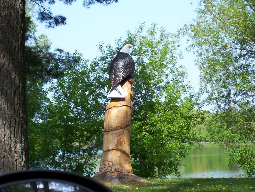 Stanley, WI: Chainsaw carved eagle watching the goings on of Chapman Park