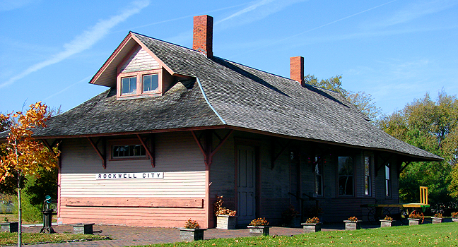 Rockwell City, IA: ALL 'BOARD!! ...for the Chicago, Milwaukee & The St. Paul railroad! Oops! They removed the tracks some years back, yet the train station survives - in a fully restored form. Built in 1899, the Rockwell City's train stop was the center-point and pride of the town. Thankfully, it still is, yet now as a train museum - showing the young, the once-ways of the old.