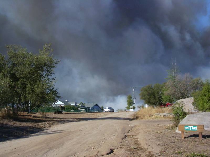 Ramona, CA: The October 2007 Witch Creek wildfire is only an hour old as it begins to overtake Triple-T Ranch in the "Witch Creek" area of Ramona, CA