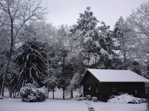 Canterbury, CT: Snow Covered cabin in Canterbury located on Bates Pond taken with cell phone winter of 2007