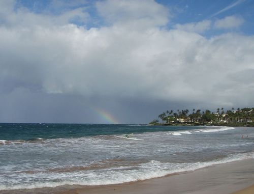 Kihei, HI: Rainbow in the distance (beyond the one-man outrigger)