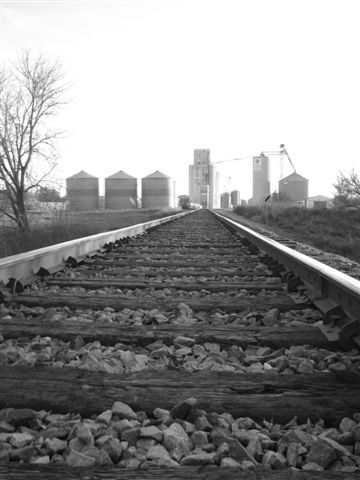 Hospers, IA: Railroad Tracks and Elevator on west side of Hospers, IA.