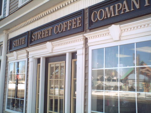 Cheboygan, MI: State Street Coffee Company with view of Ottawa Art Park in reflection