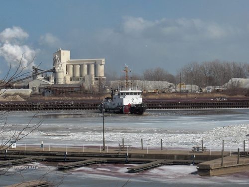 Huron, OH: Boat breaking ice so ships can come to the Huron Basin (winter)