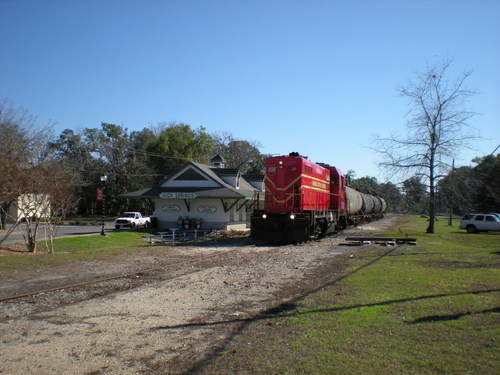 High Springs, FL: This 1956 vintage Electro-Motive diesel (FCEN 47) was seen heading north through High Springs on New Years Eve, 2008, on the Florida Northern Rail Road with empty wagons from Prime Conduit. This approximately 1.75 straight length of track passing through the center of High Springs is all that remains of the Atlantic Coast Line track from Alachua through High Springs and Fort White to Live Oak. Thanks to local businesses who use rail, sights like this are still with us. This stretch of line connects south to Newberry via a switch just north of the Golden Peanut Company. These fragments of the old Alachua County railroad system, as well as remaining track beds that could be re-laid, offer the opportunity for the development of a local light passenger public transport rail system that could serve the community in the years ahead and the population density and industrial, commercial, and residential development increases in the area in combination with higher fuel prices.