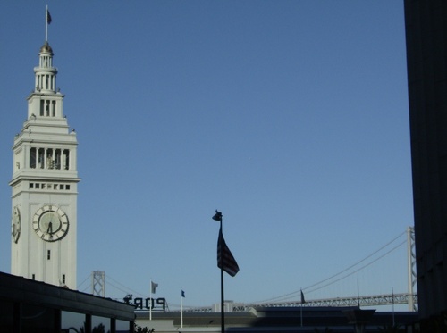 San Francisco, CA: Summer 2007, clock tower & the American flag near the Bay Bridge.