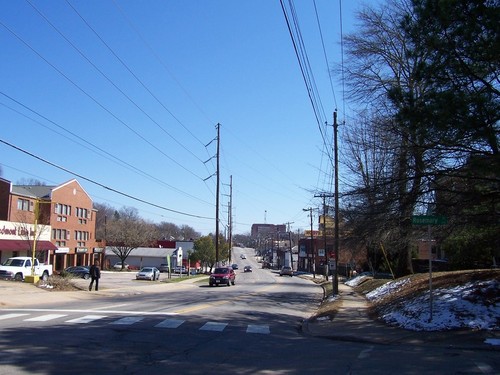Raleigh, NC: A look eastwards down Hillsborough Street from Rosemary Street in Raleigh, North Carolina in early March, 2009. A bit of unmelted snow can be seen on the lawn to the right.