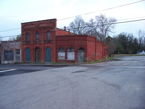 Buckhead, GA: Some creepy old red brick storefronts at dusk in Buckhead, Morgan County, Georgia.