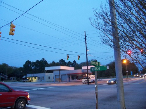 Pontiac, SC: Cars wait for the light to change at the corner of Bookman Road and Two Notch Road in the cool of the evening.