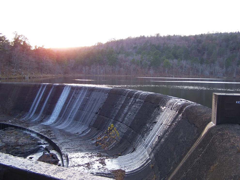 Wilburton, OK: View of the spillway and setting sun at Robbers Cave State Park