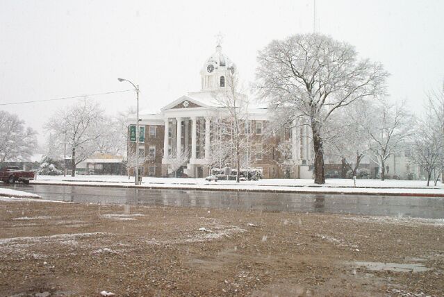 Marietta, OK: Love County Courthouse with small amount of snow.