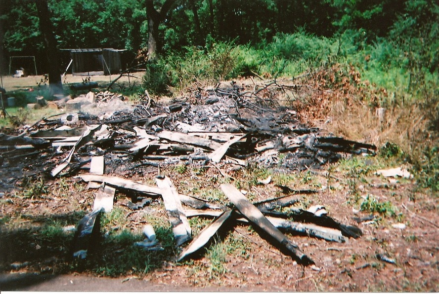 Booneville, AR: Booneville is such a beautiful place, in the city limits you can run across such sites as this. Just drive by Paul Street and you can learn how to burn roofing material and all your trash.