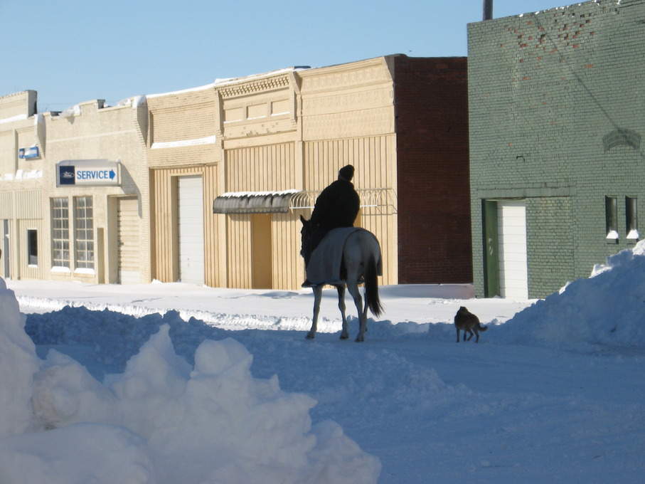 Caney, KS: Heading down Spring St after snowfall in Caney 2006